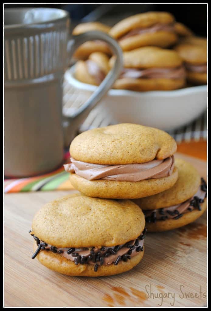 Pumpkin Whoopie Pies with Chocolate Cream Cheese Filling- so moist and delicious, you will crave these all year long #pumpkin www.shugarysweets.com