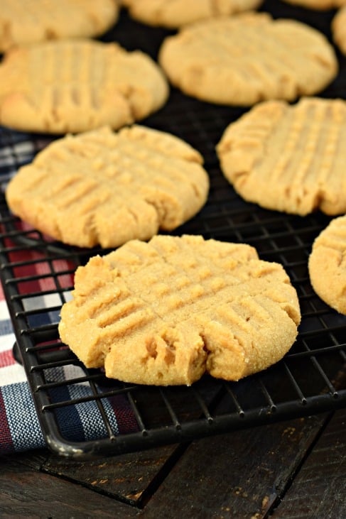 Peanut butter cookies on black wire rack