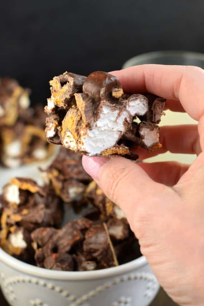 3 ingredient smores bars being held in one hand.