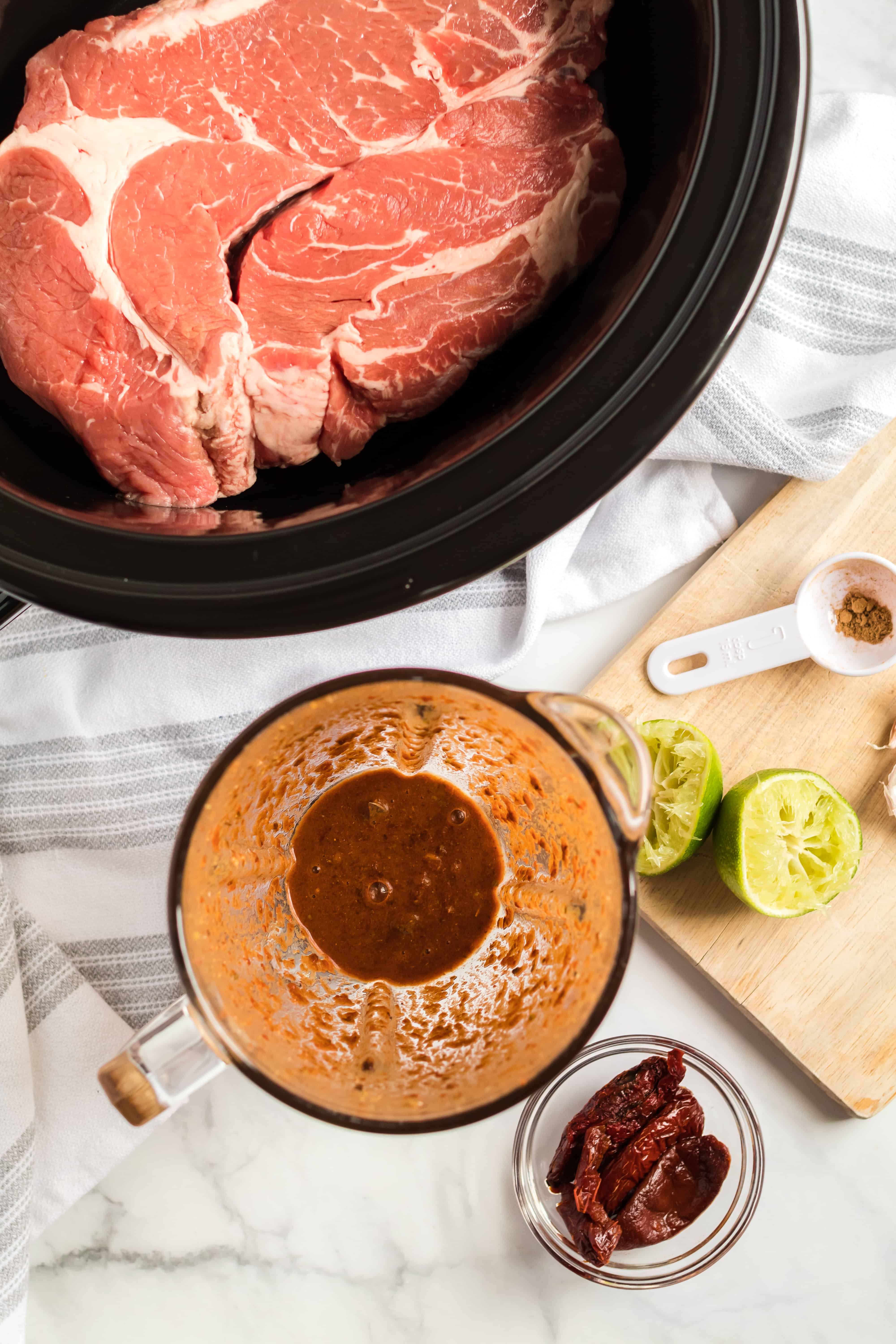 Blender filled with chipotle peppers to make barbacoa sauce.