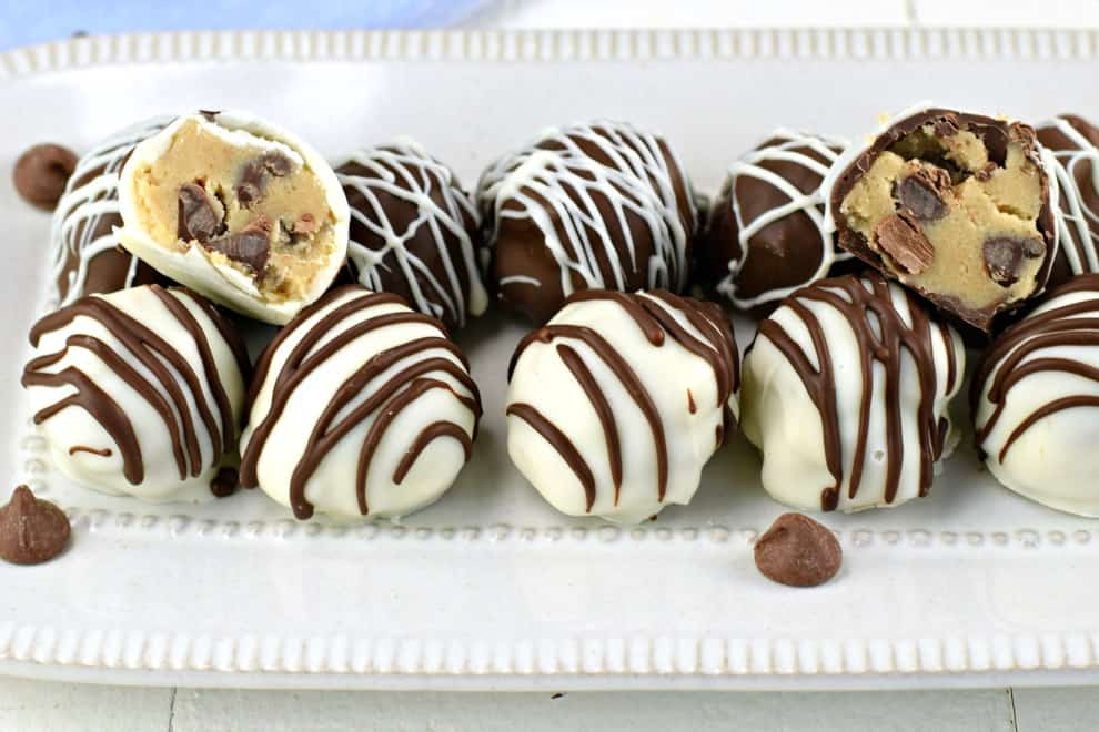 Plate with white chocolate and dark chocolate cookie dough truffles
