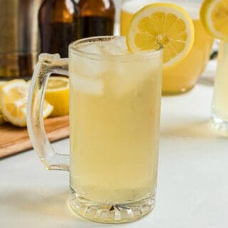 Beer mug filled with lemonade beer.