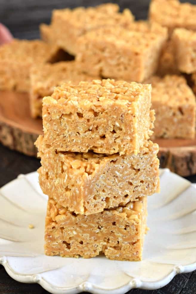 Stack of three thick biscoff flavored rice krispie treats.