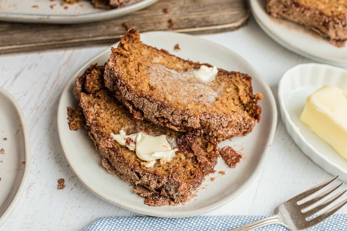 Two slices of amish bread with melted butter on top.