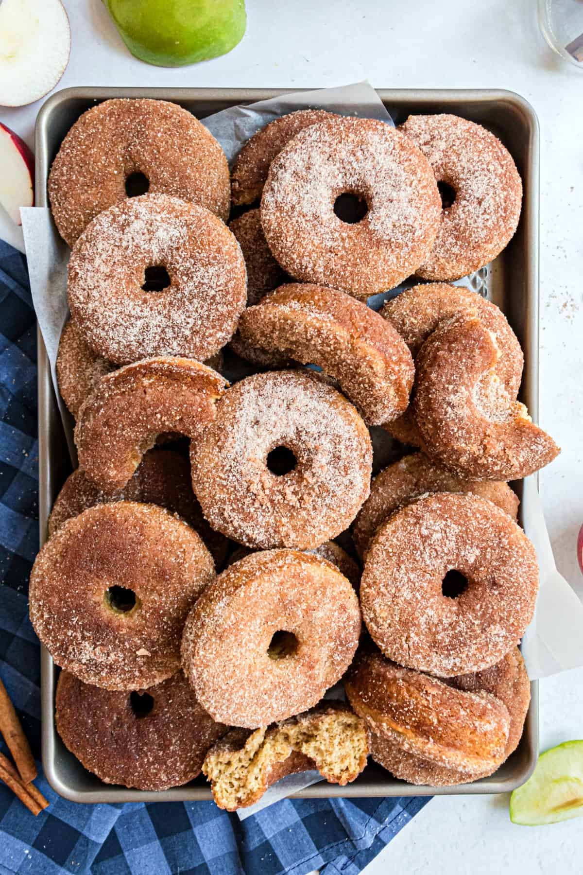 Baking sheet filled with apple cider donuts to serve.