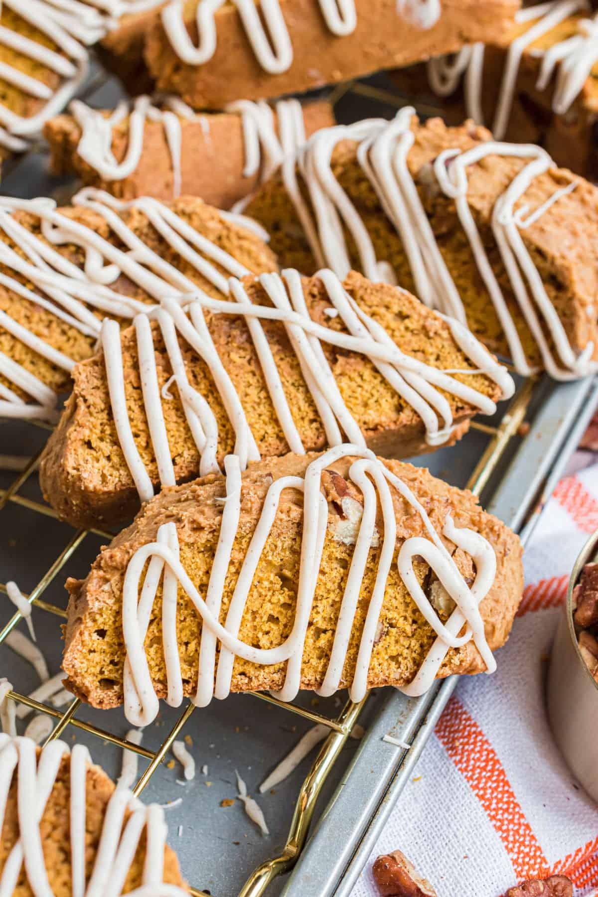 Pumpkin spice biscotti drizzled with white chocolate icing.