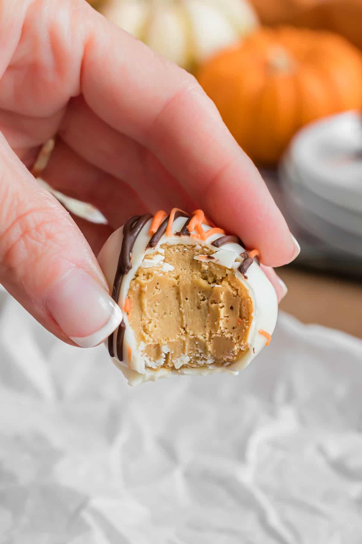 Pumpkin truffle with bite removed.