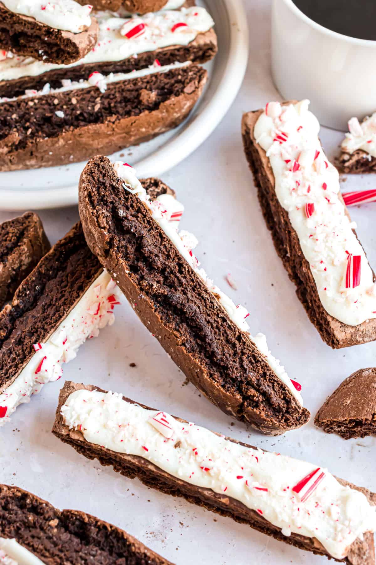 Thick slices of chocolate biscotti dipped in white chocolate and candy canes.