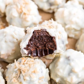 Chocolate truffles dipped in white chocolate and coconut.
