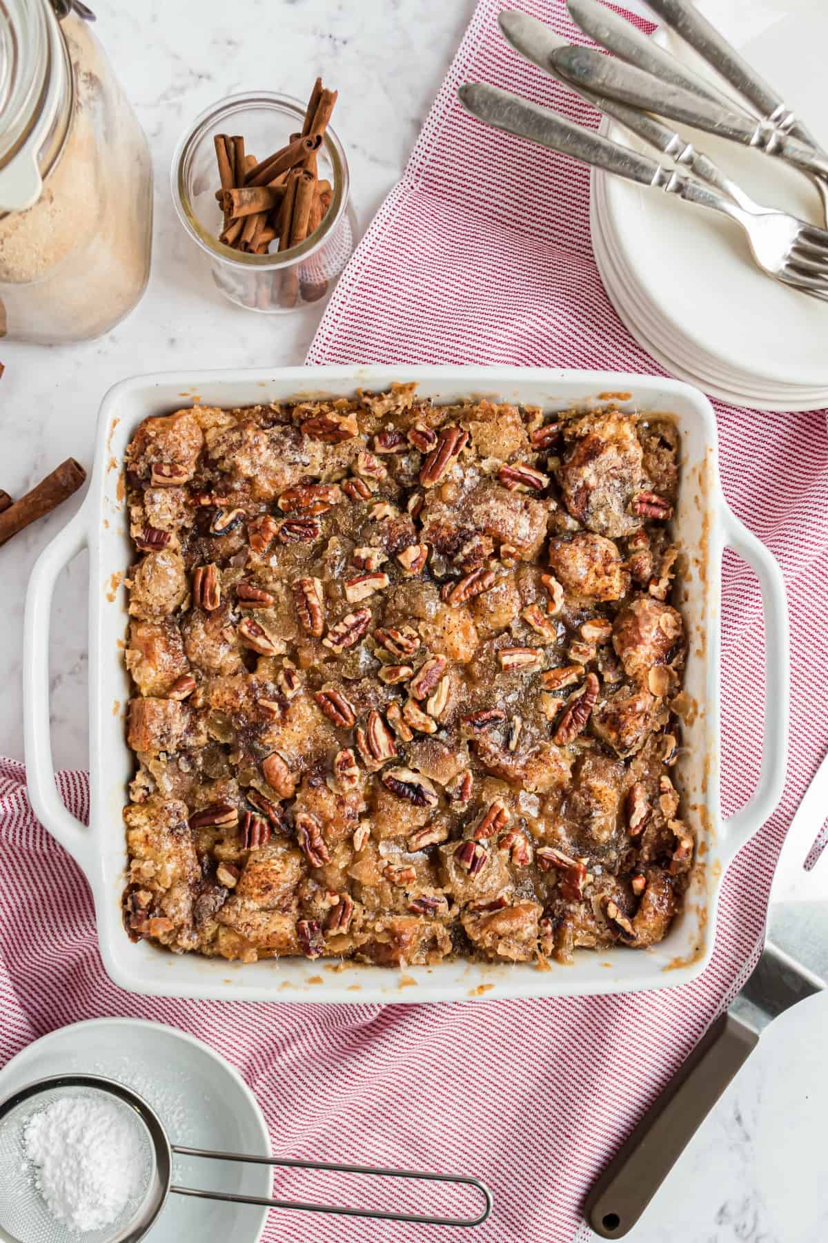 Square baking dish with eggnog french toast casserole baked.