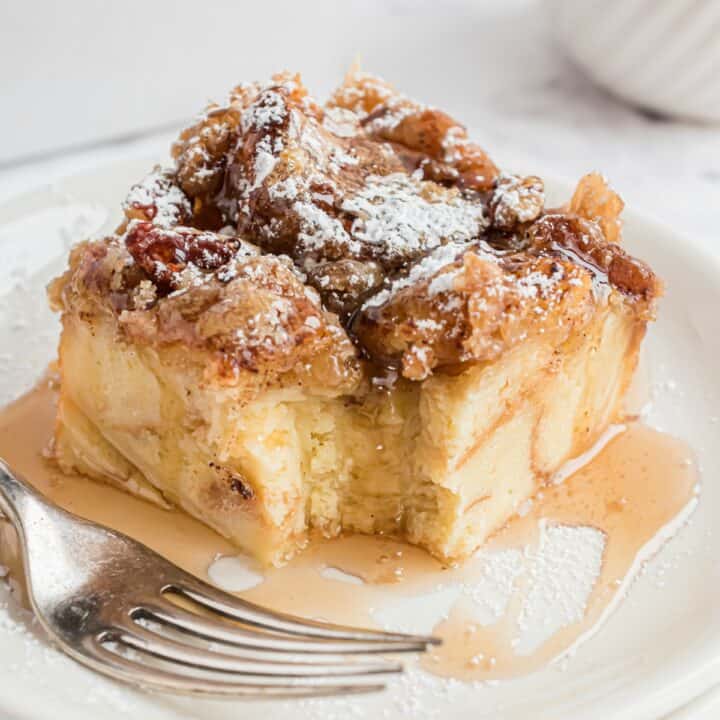 Slice of eggnog french toast with bite removed.