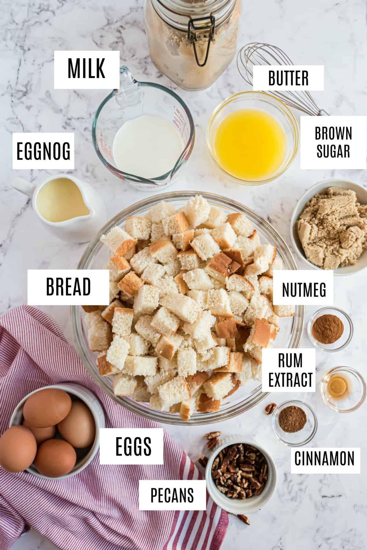 Ingredients needed for eggnog french toast bake, including bread, butter, and eggnog.