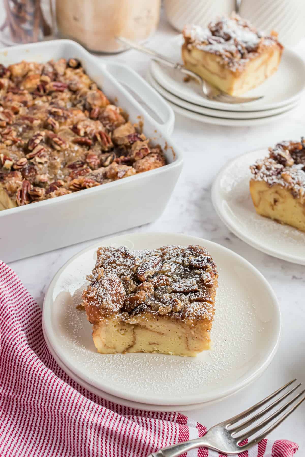 Slice of eggnog french toast with powdered sugar.