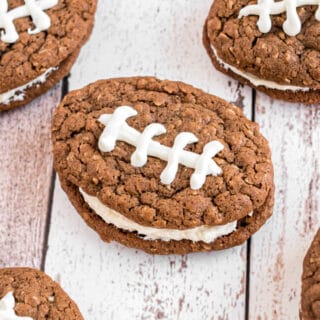 Football shaped chocolate oatmeal cream pies with white chocolate laces.