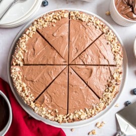 Chocolate Hazelnut Tart is filled with silky chocolate mousse and drizzled with ganache for one of the dreamiest chocolate desserts you'll ever make. As beautiful as it is delicious, this chocolate tarte steals the show!