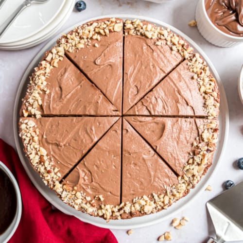 Chocolate Hazelnut Tart is filled with silky chocolate mousse and drizzled with ganache for one of the dreamiest chocolate desserts you'll ever make. As beautiful as it is delicious, this chocolate tarte steals the show!