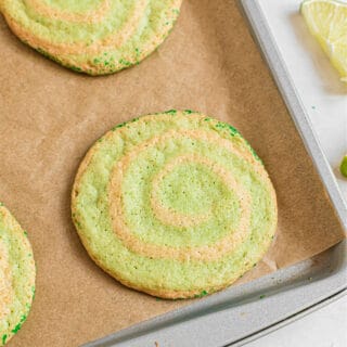 These Lime Swirled Icebox Cookies are here to add some zest to your sweet snacking! Flecked with green and kissed with lime flavor, Ice Box Cookies are a spring and summertime favorite.