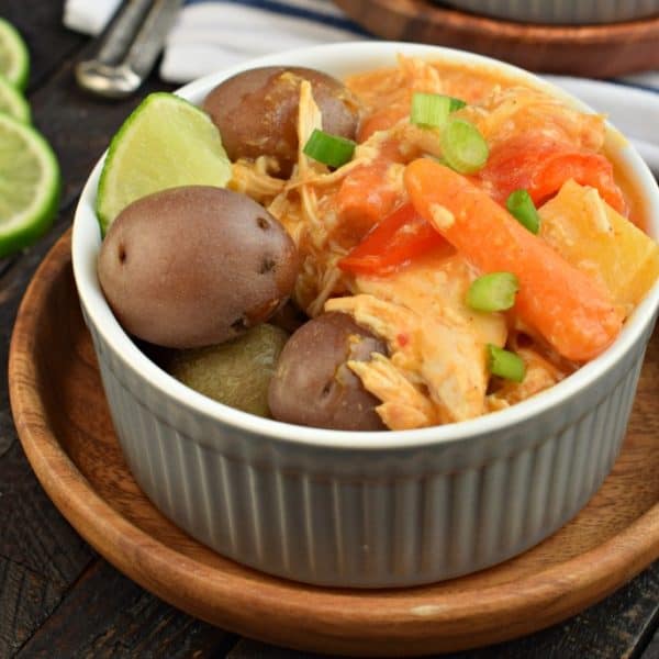 Slow cooker chicken curry with pineapple, peppers, onion, and potatoes.