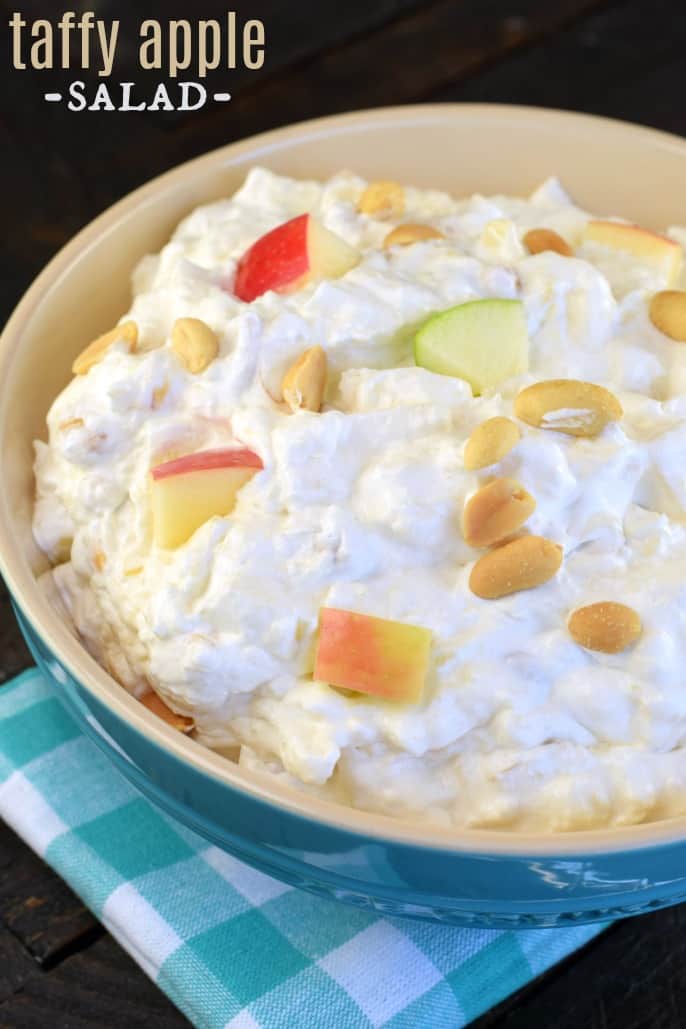 Salad with peanuts, apples, whipped cream, and pineapple.