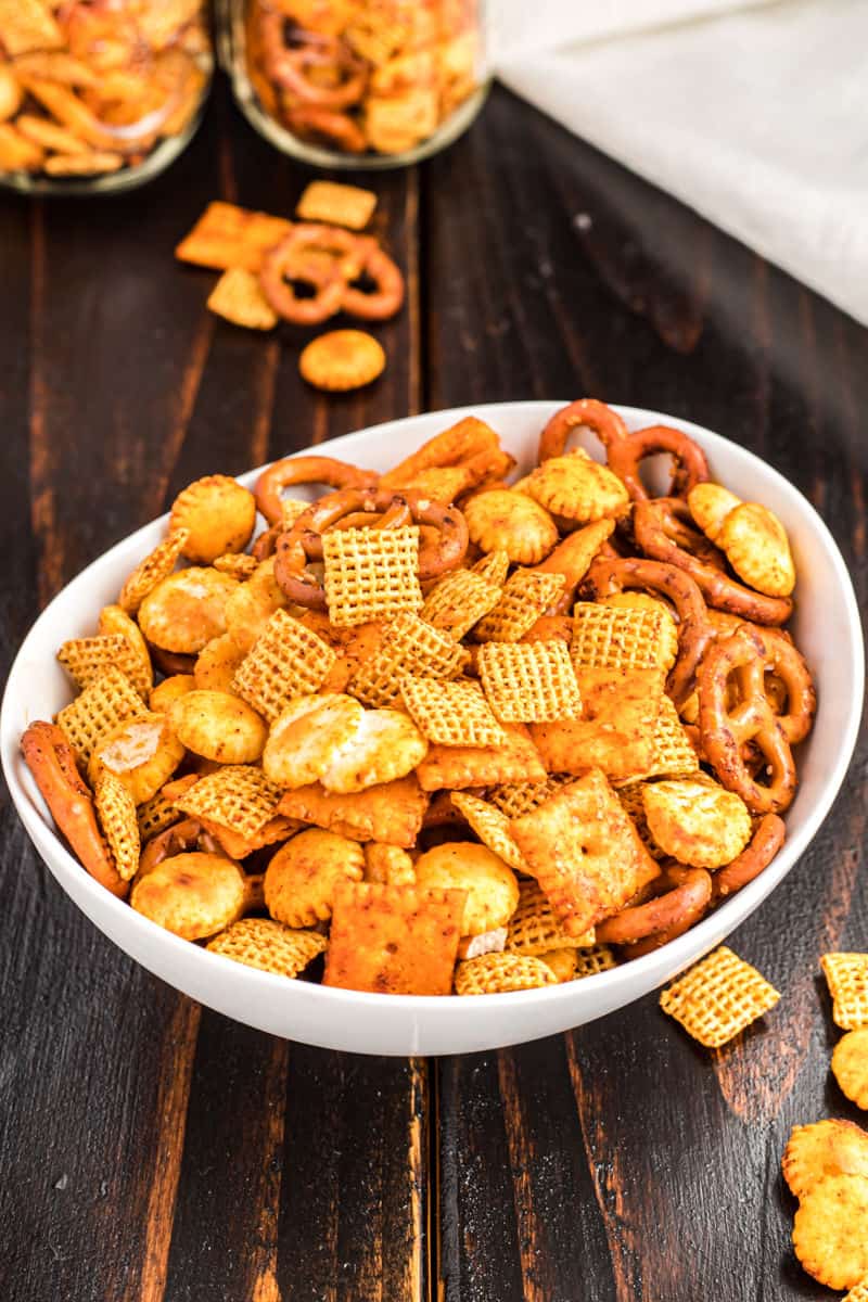 Spicy chex taco snack mix in a white bowl.