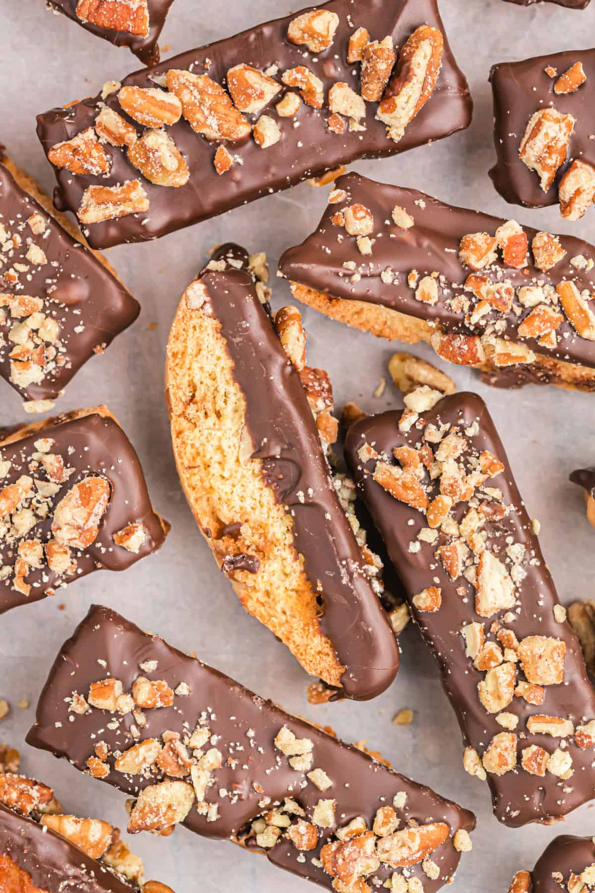 Biscotti dipped in chocolate with pecans.