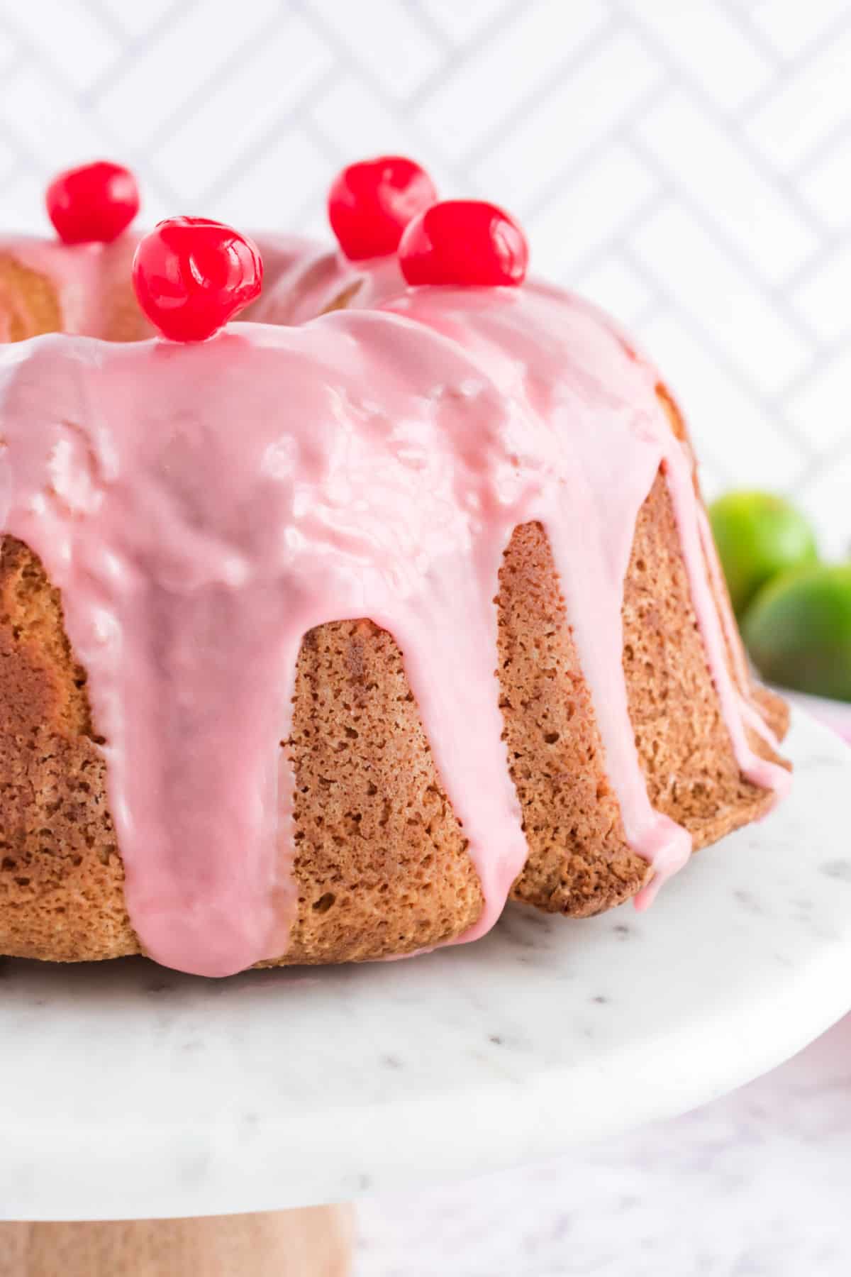 Cherry margarita pound cake on marble cake plate.