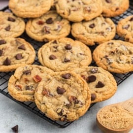 Bacon lovers rejoice! Maple Bacon Cookies bring your favorite breakfast combo into an easy to make dessert. Chewy chocolate chip cookies loaded with bacon bits and maple flavor.