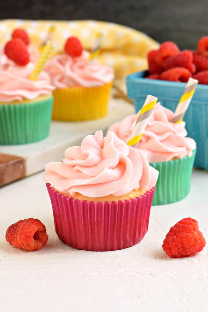 Swirls of raspberry lemonade frosting on a cupcake.