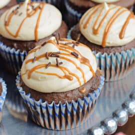 Rich Chocolate Cupcakes topped with a creamy, homemade Biscoff Frosting! This nut free chocolate cupcake recipe will be the hit of any party or bake sale.