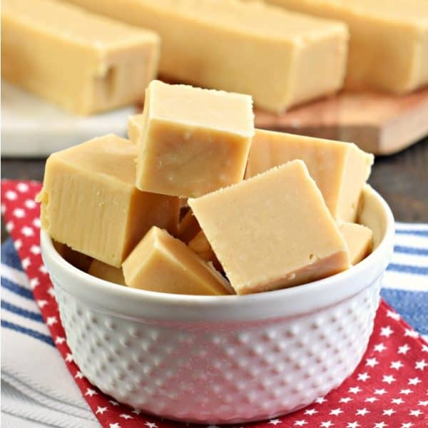 The Best Peanut Butter Fudge recipe with no candy thermometer needed. Soft and creamy and packed with peanut butter flavor, this easy fudge recipe is perfect all year long!