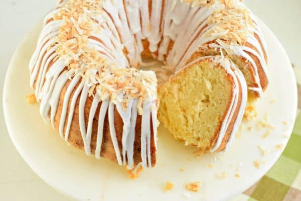 Everyone's favorite tropical beverage turned into a scrumptious and easy pound cake! Pina Colada Pound Cake is full of pineapple flavor and topped with a coconut glaze.