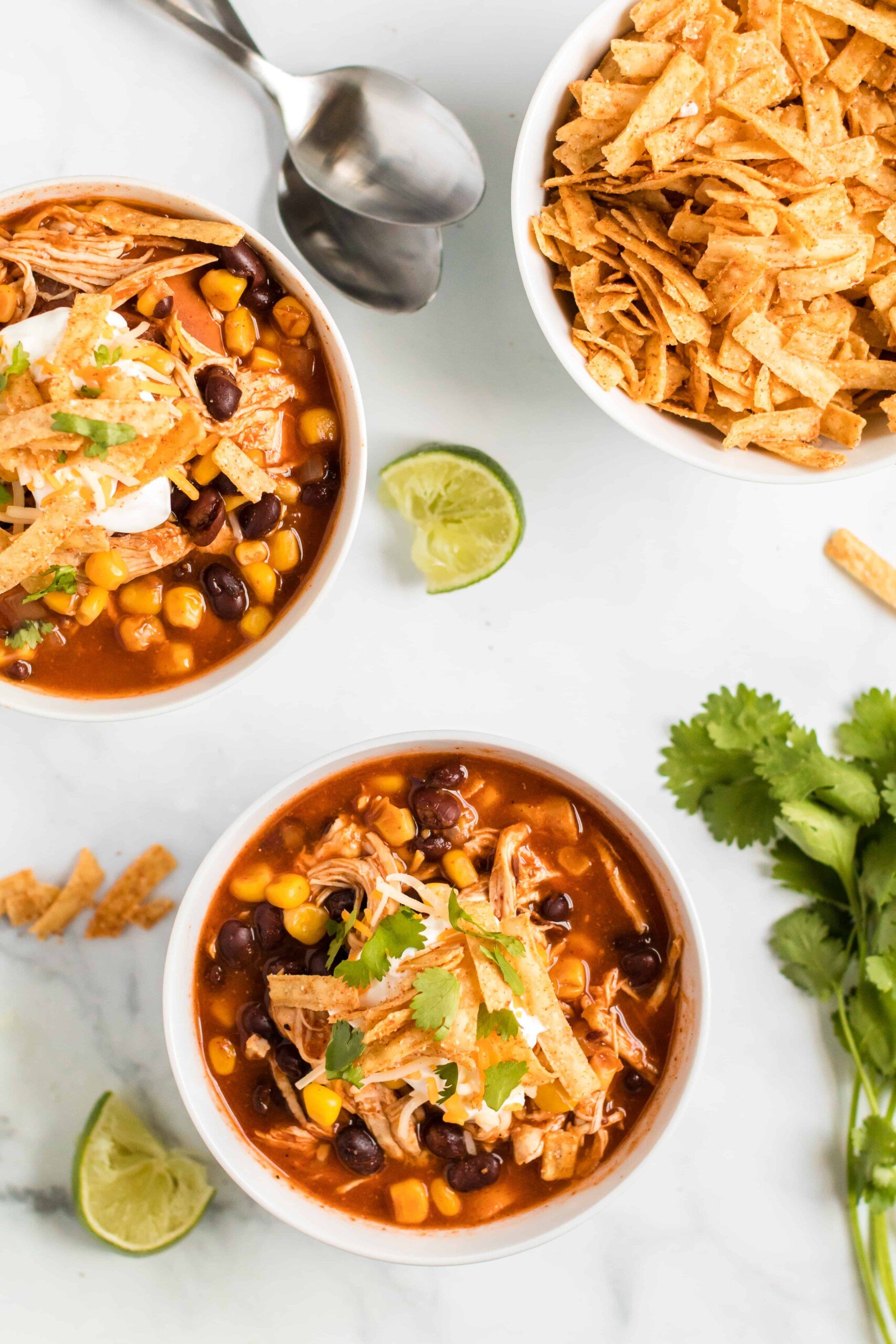 Two bowls of chicken enchilada soup.