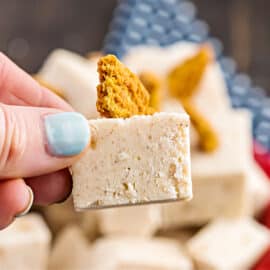 Soft and sweet, Apple Pie Fudge is the perfect bite sized version of the classic pie. An easy homemade fudge packed with apple pie filling and warming spices. No candy thermometer needed!