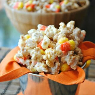 Homemade caramel corn with peanuts and candy corn to resemble a payday candy bar.