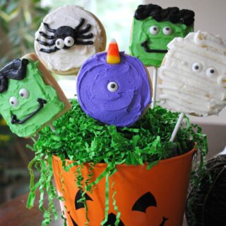 Bouquet of monster sugar cookies on lollipop sticks.