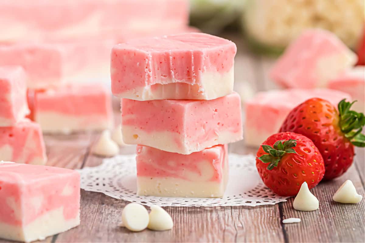 Stack of three pieces of strawberry swirl fudge.