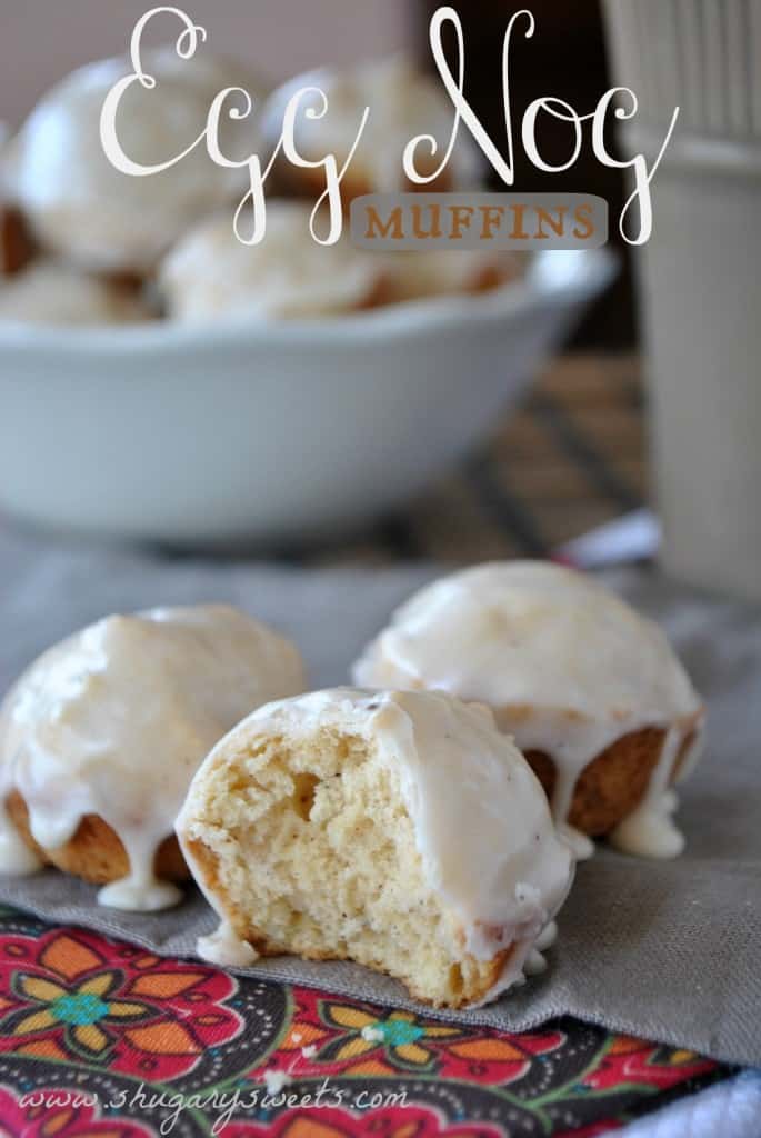 EggNog Muffins- deliciously easy Christmas morning treats! #eggnog www.shugarysweets.com Eggnog mini muffins on a linen with one bite removed.