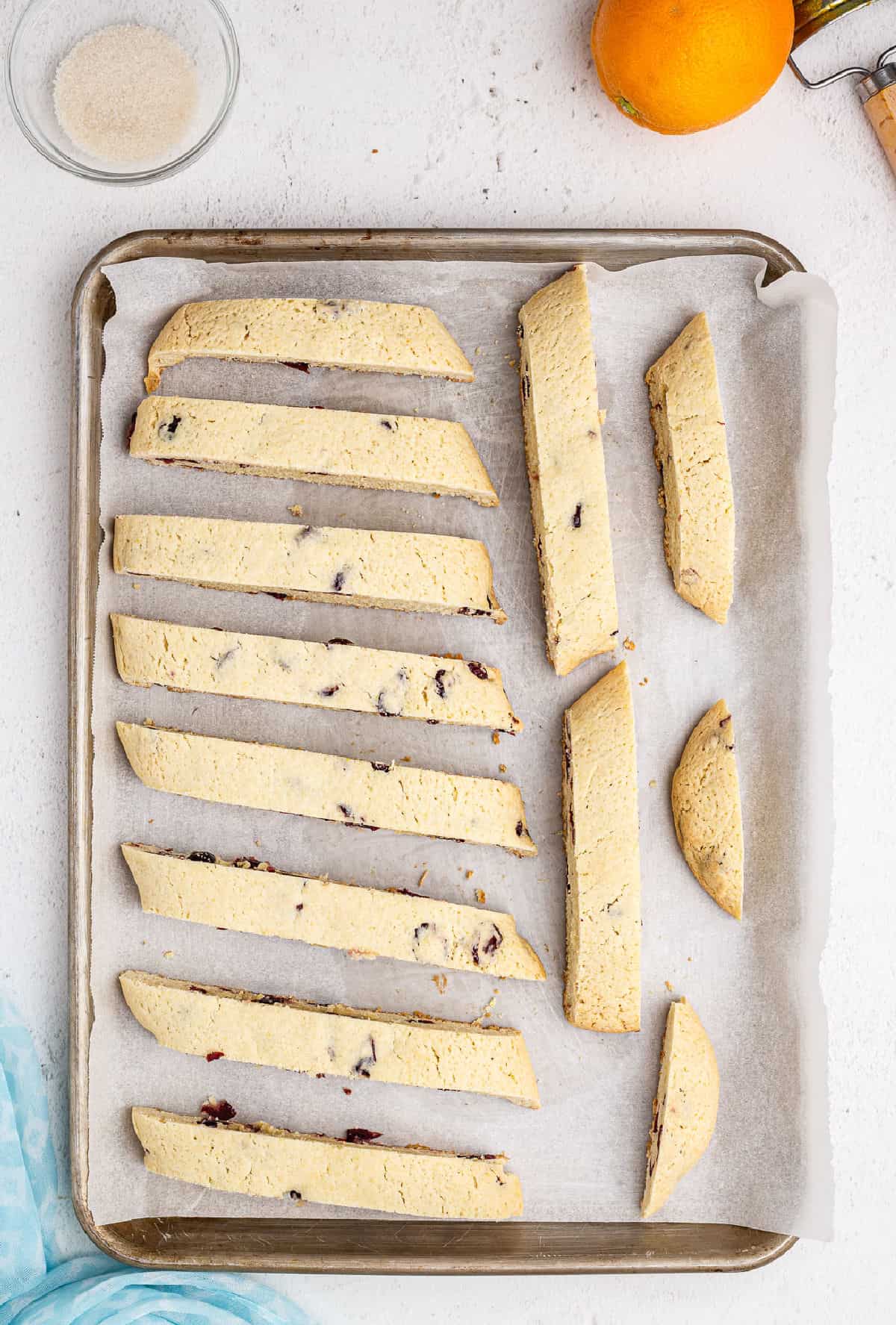 Cranberry orange biscotti on cookie sheet.