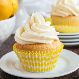 Lemon cupcake with high swirl of lemon frosting.