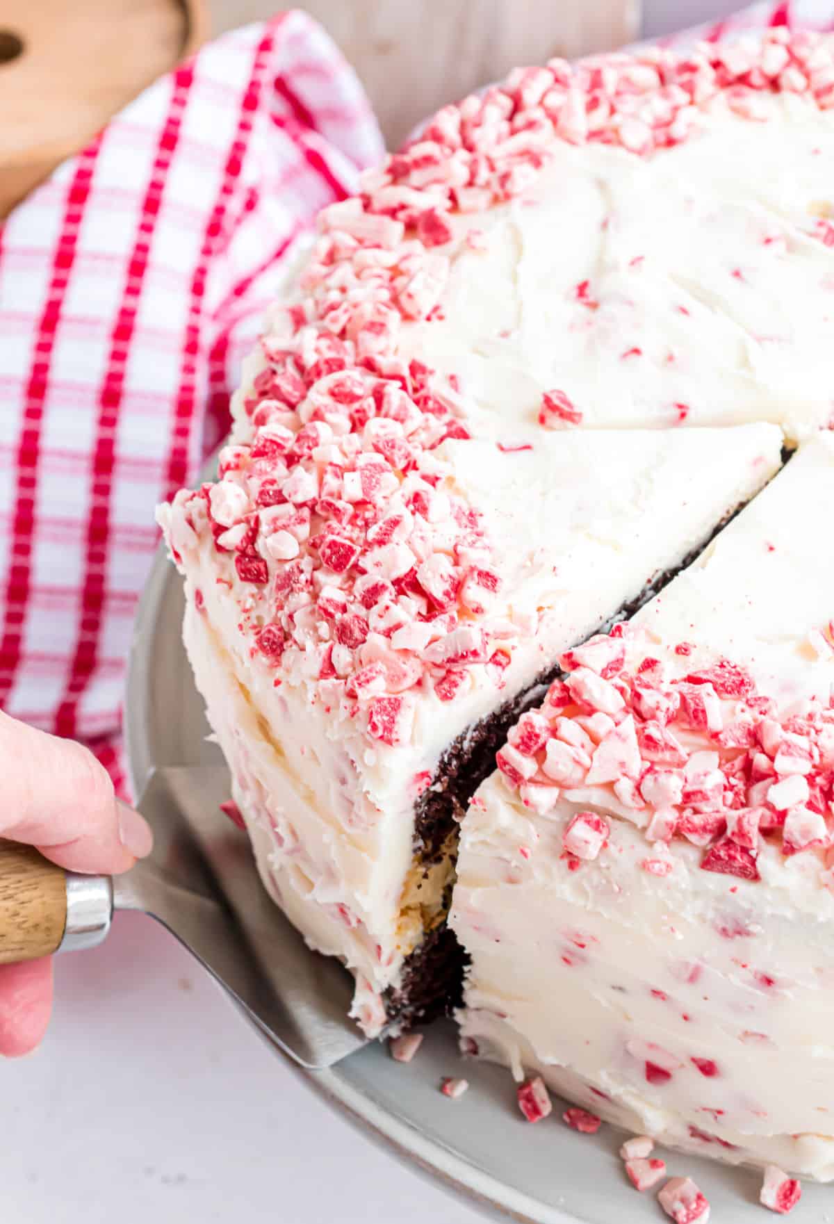 Chocolate cake covered in peppermint andes candies.