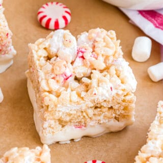 Classic Rice Krispie Treats get a candy cane twist! Sticky and sweet with a cool minty kick, Peppermint Rice Krispie Treats taste even better when they're dipped in white chocolate.