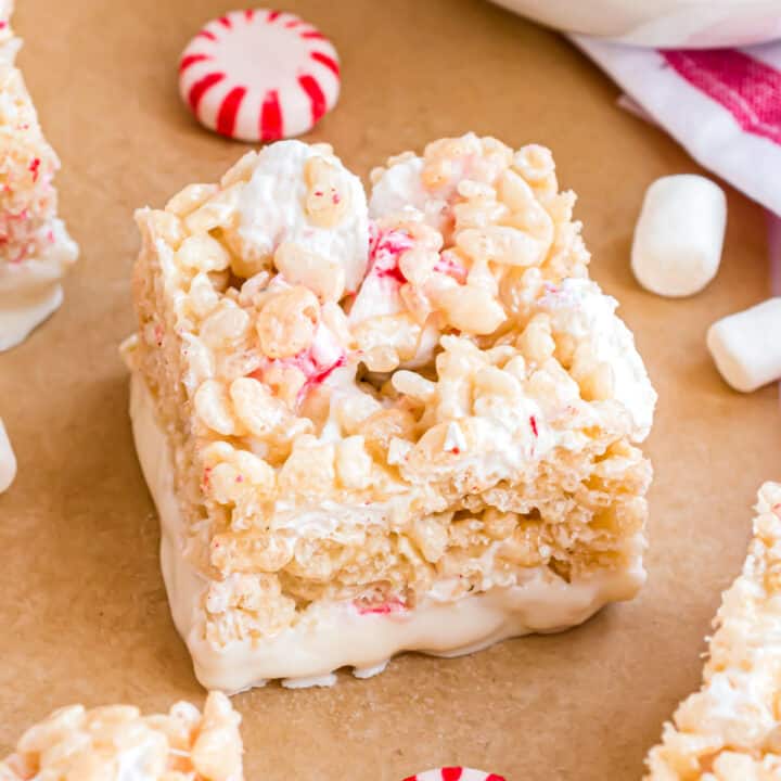Classic Rice Krispie Treats get a candy cane twist! Sticky and sweet with a cool minty kick, Peppermint Rice Krispie Treats taste even better when they're dipped in white chocolate.