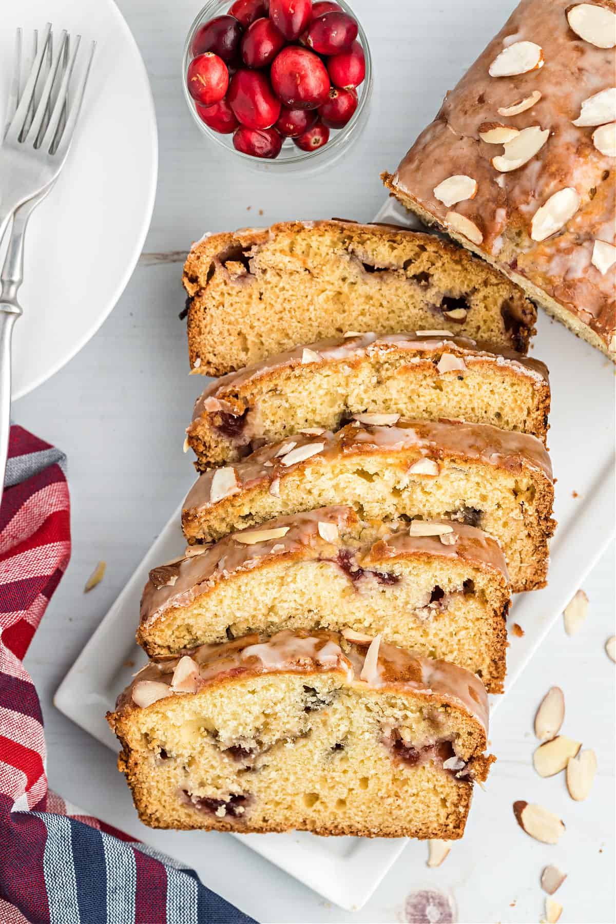 Sliced loaf of cranberry almond bread.