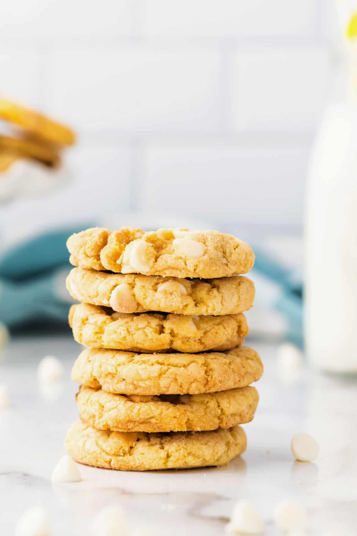 Stack of 6 lemon oreo crunch cookies on white counter.