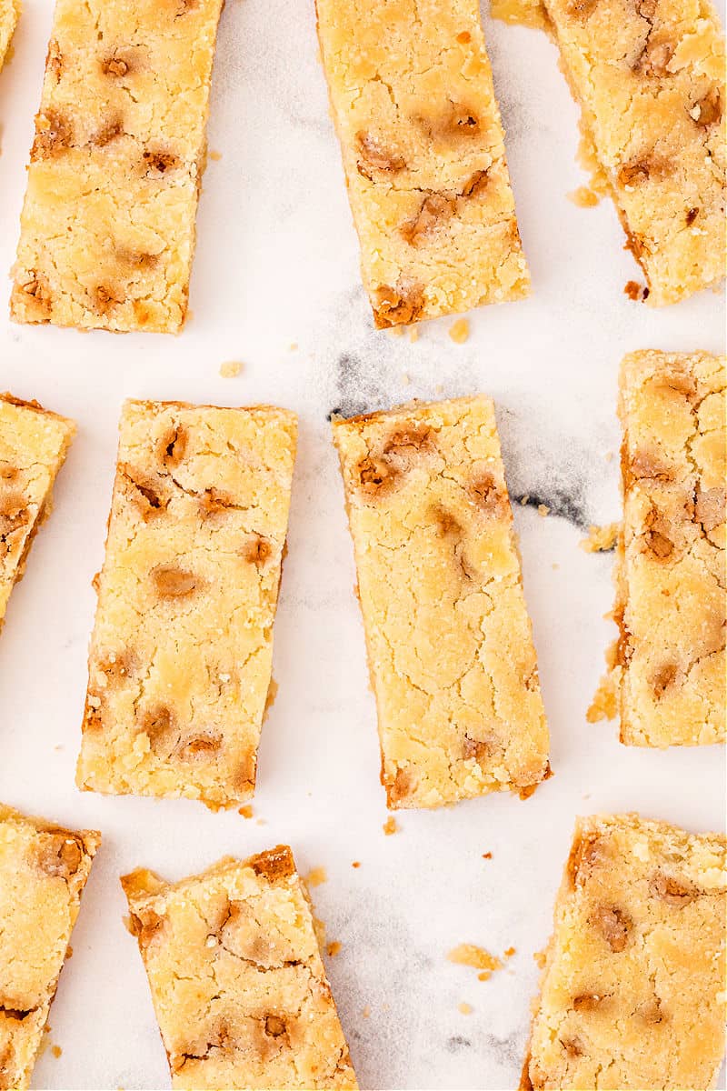 Butterscotch shortbread cookie bars on marble counter.