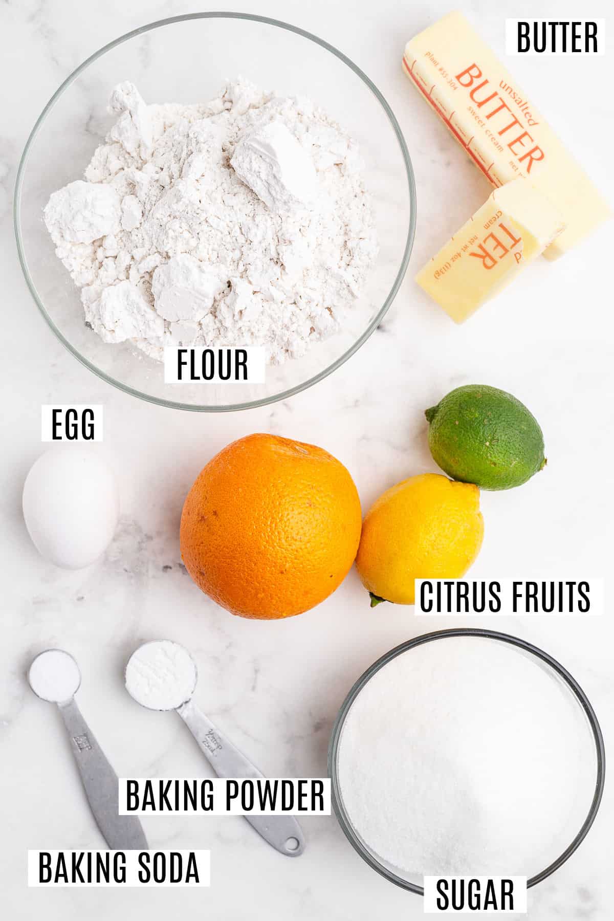 Ingredients needed to bake citrus flavored cookies.