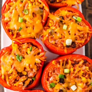 Stuffed red peppers with cheese and green onions.