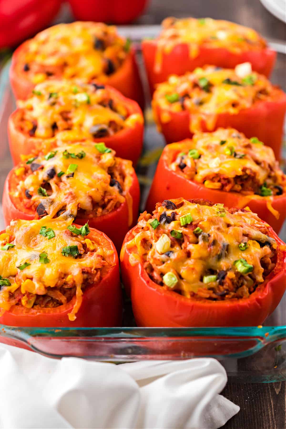 Stuffed peppers with a mexican filling and topped with melted cheese.