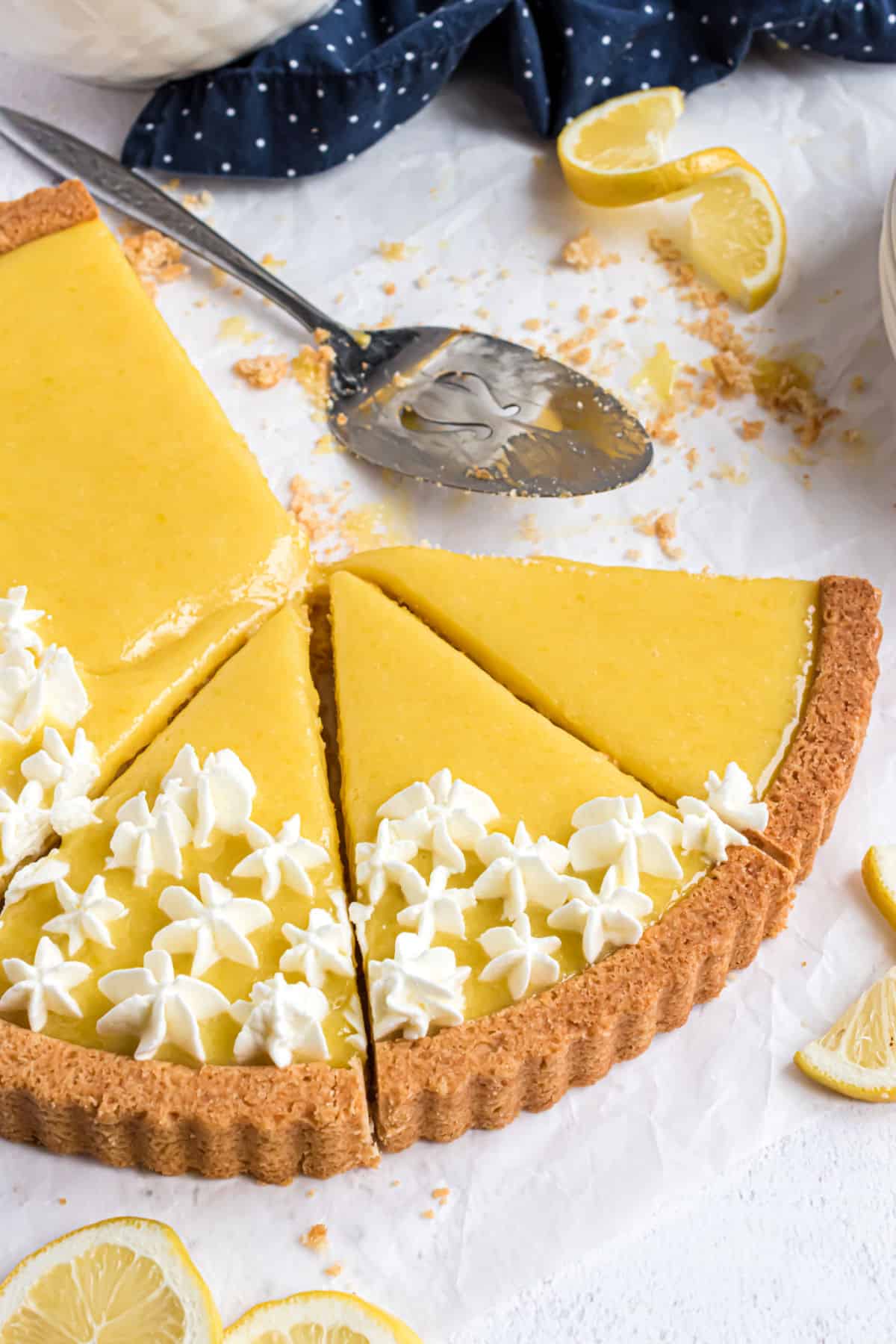 Sliced lemon tart with a golden crust.