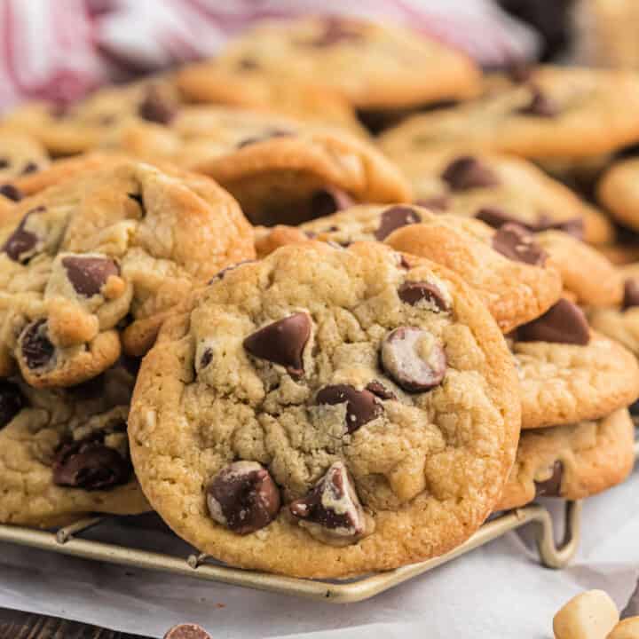 There's nothing like one of these Milk Chocolate Macadamia Nut Cookies warm from the oven. Sweet chocolate morsels and nuts are baked into soft chewy cookies in this easy recipe. Best served with a glass of cold milk!
